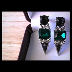 Long gem and stone stud earring.